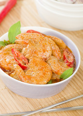 Thai Prawn Curry - King prawns in red curry sauce and coconut milk in a lilac bowl.