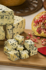 Different cheeses on a cutting board, delicious food