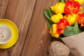 Colorful tulips bouquet and coffee cup