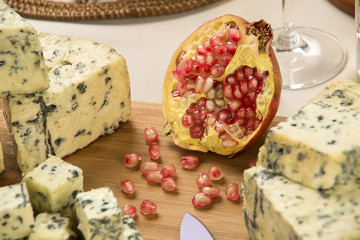 Different cheeses on a cutting board, delicious food