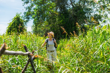 Woman hiking in tropical field