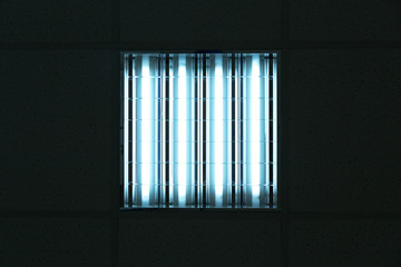 Fluorescent lights in office ceiling
