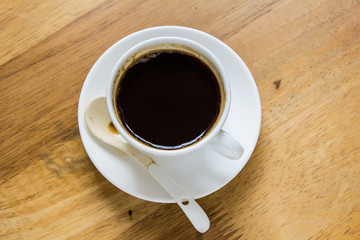 Cup of coffee on a wooden table