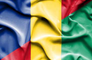 Obraz premium Waving flag of Guinea and Romania