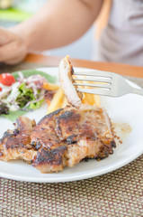 Piece pork steak on chicken forn