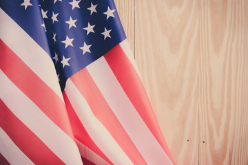 Fototapeta premium independence day 4 JULY america flag on wood background Filtered image processed vintage effect.