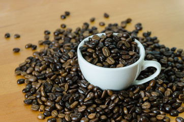 Coffee beans in white cup