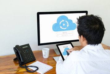 Man use cloud technology on tablet and computer