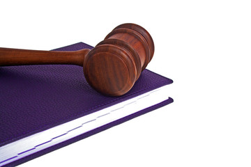 Wooden mallet and diary on a white background