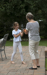 Obraz premium Elderly woman playing ball with a young child