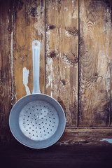 old aluminum colander