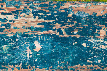 Rough wooden background with peeling paint