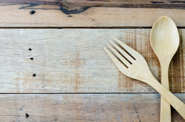 Spoon and fork on wood table