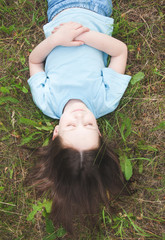 girl lying on the grass