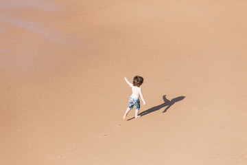 Boy child playtime beach happiness 