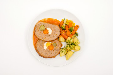 Roll of meat and vegetables.