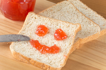 whole wheat bread with strawberry jam