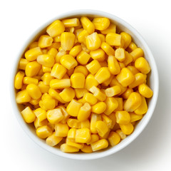 Bowl of tinned sweetcorn isolated from above on white. - obrazy, fototapety, plakaty
