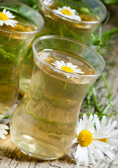 Fresh chamomile tea, selective focus