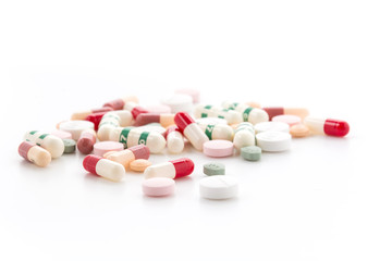 Obraz na płótnie Canvas diferent Tablets pills capsule heap mix therapy drugs doctor flu