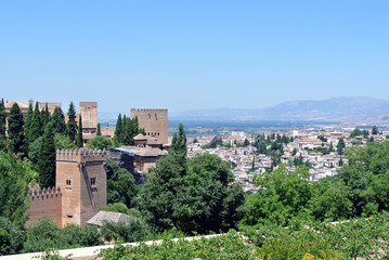Fototapeta na wymiar Panoramic view on Alhambra palace and the city of Granada in Andalusia, Spain, on a sunny day.