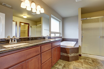 Elegant master bathroom with tile floor.
