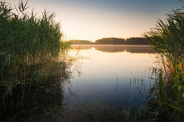 Fototapeta na wymiar Sunrise over Selment Wielki Lake. Masuria. Poland
