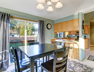 Nice dinning room with carpet and windows.