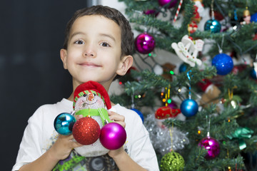 Fototapeta na wymiar Happy Child enjoying at home at Christmas
