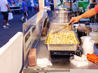 Preparing fish balls at night market
