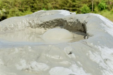 Mud volcano  refers to formations created by geo-exuded slurries and gases.