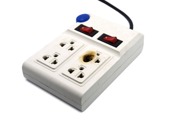 Dirty melted and burned electric outlet plug on white background