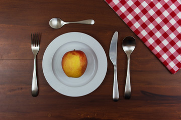 apple on a white plate