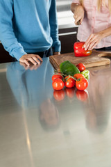 couple chopping vegetables