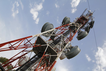 Telecommunications tower against blue sky