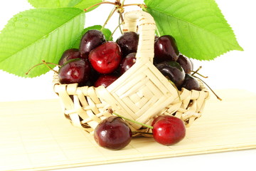 cherry with leaves in pure white background