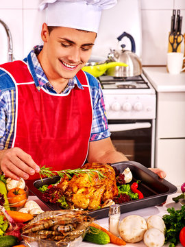 Man In Chef Hat Cooking Chicken