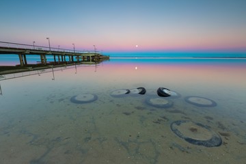 Beautiful wooden pier on Baltic sea shore
