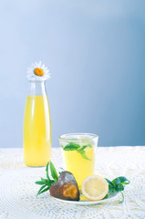 Fresh cold lemonade with mint leaves and cookies