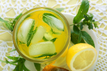 Fresh cold lemonade with mint leaves and cookies
