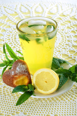 Fresh cold lemonade with mint leaves and cookies