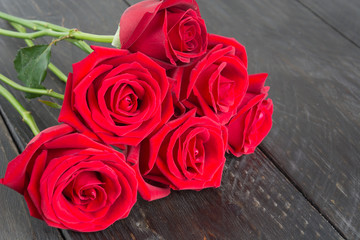 red rose on wood background