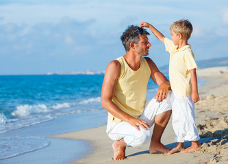 Father and son on beach