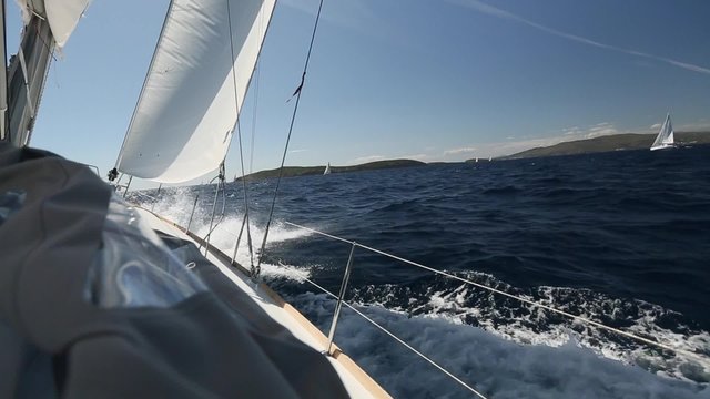 Sailing in the wind through the waves (HD) Sailing boat shot in full HD at the Sailing in the Aegean Sea.