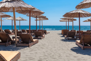 Umbrellas and beach chairs on the beach.