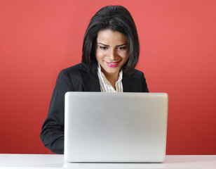 Young business woman smiling using computer