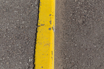 Yellow curb stone border