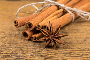 Close up of cinnamon sticks and star anise on wood