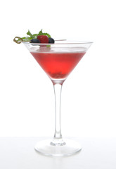 Red alcohol cosmopolitan cocktail decorated with mint bluberry a