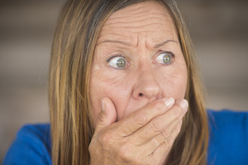Shocked upset frightened woman portrait